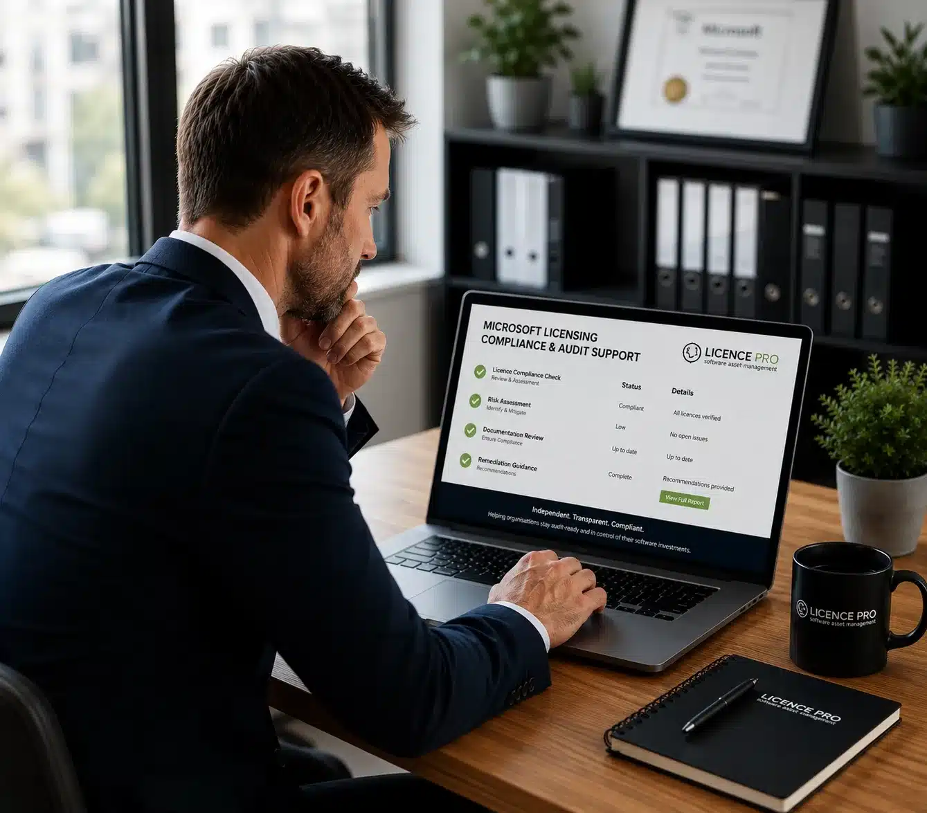 Microsoft licensing compliance specialist reviewing software audit documentation in a modern office